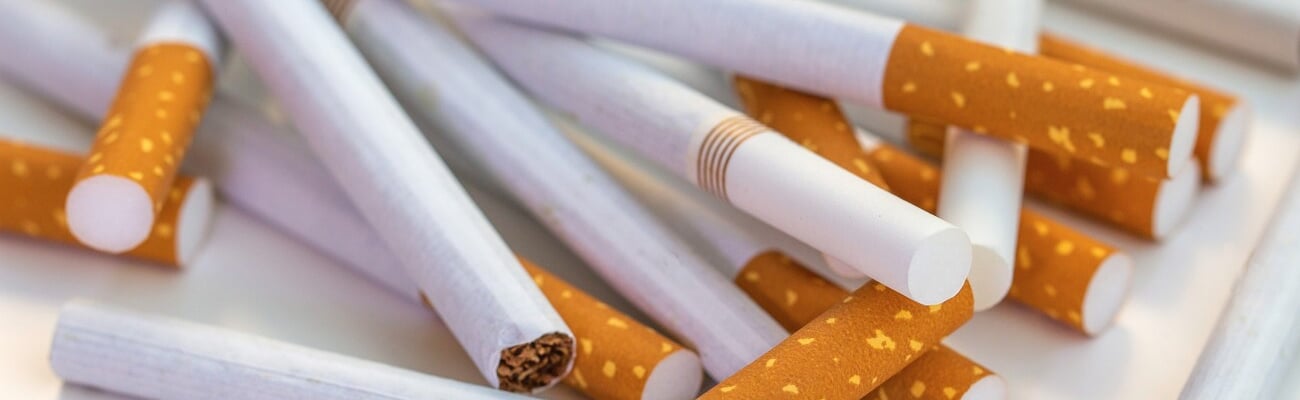 Close up stack of cigarettes on white background. cigarettes isolated on white; Shutterstock ID 2512615585