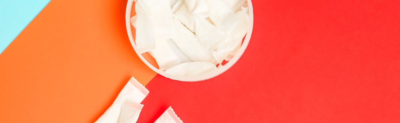 Nicotine pouches on orange background