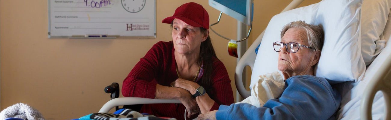 Woman on hospital bed.