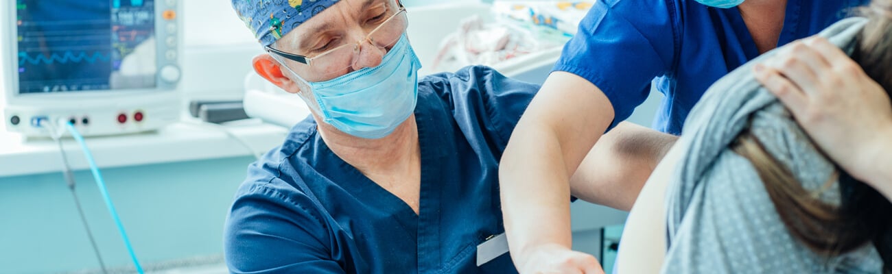 Epidural shot. Nurse comforting pregnant woman, doctor gives Epidural.; Shutterstock ID 1893868645