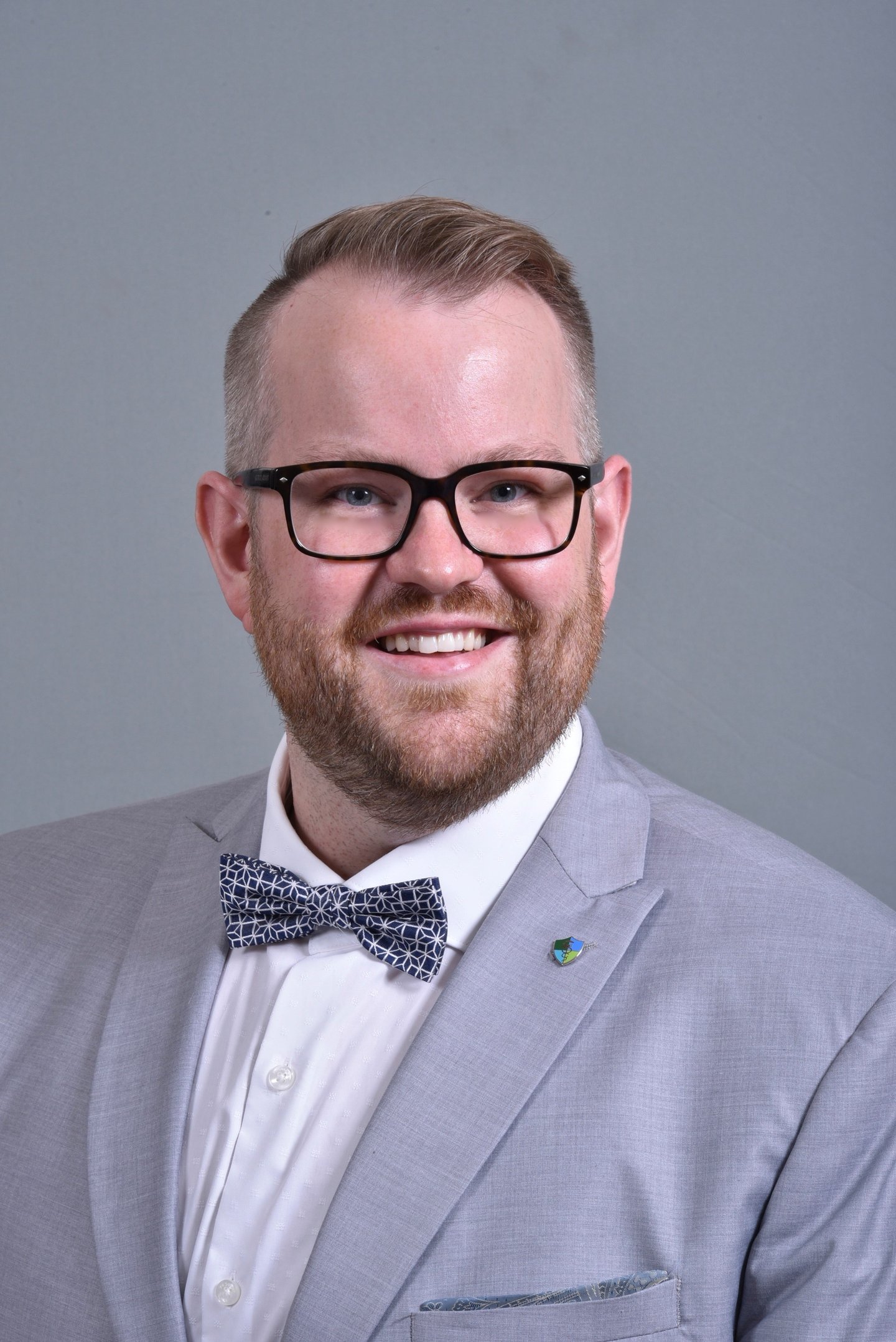 a man wearing a bow tie and glasses