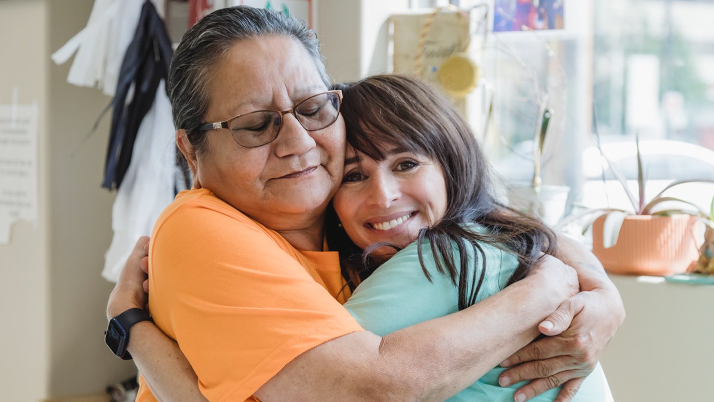 Two people hugging