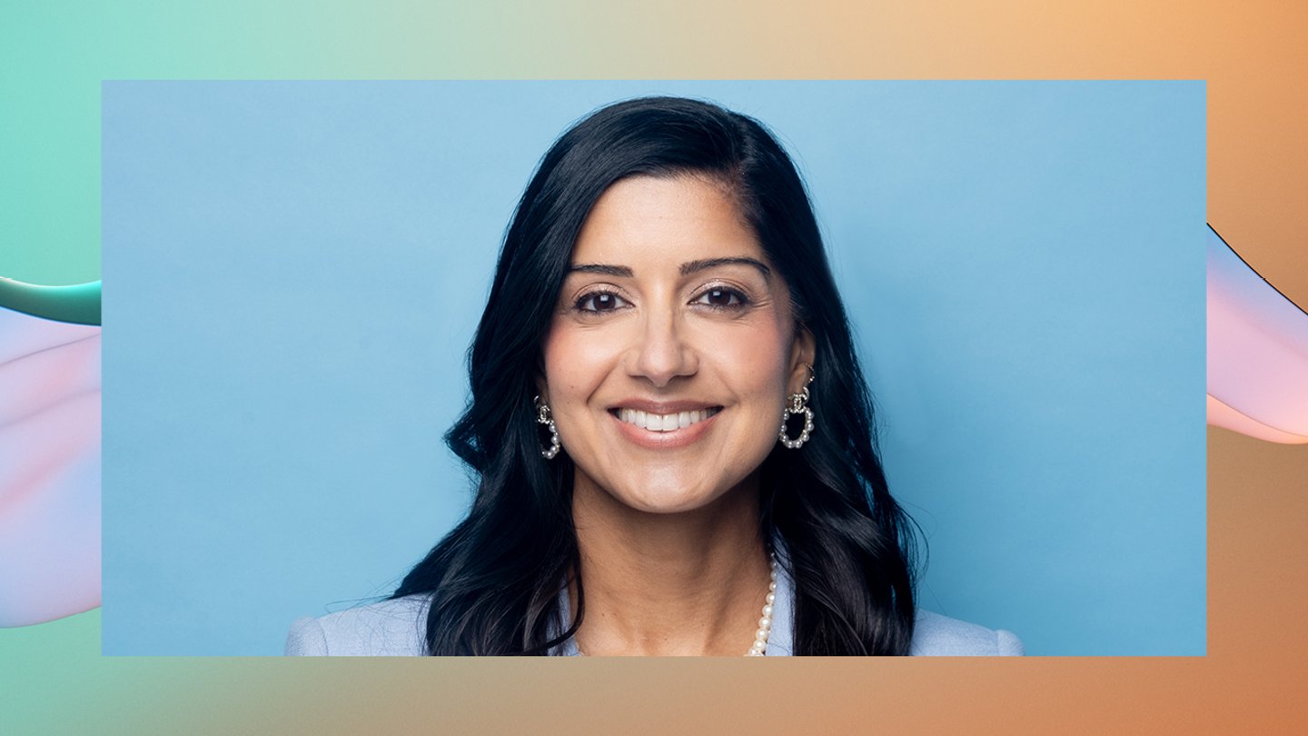 Shivali Sharma smiling with a blue background