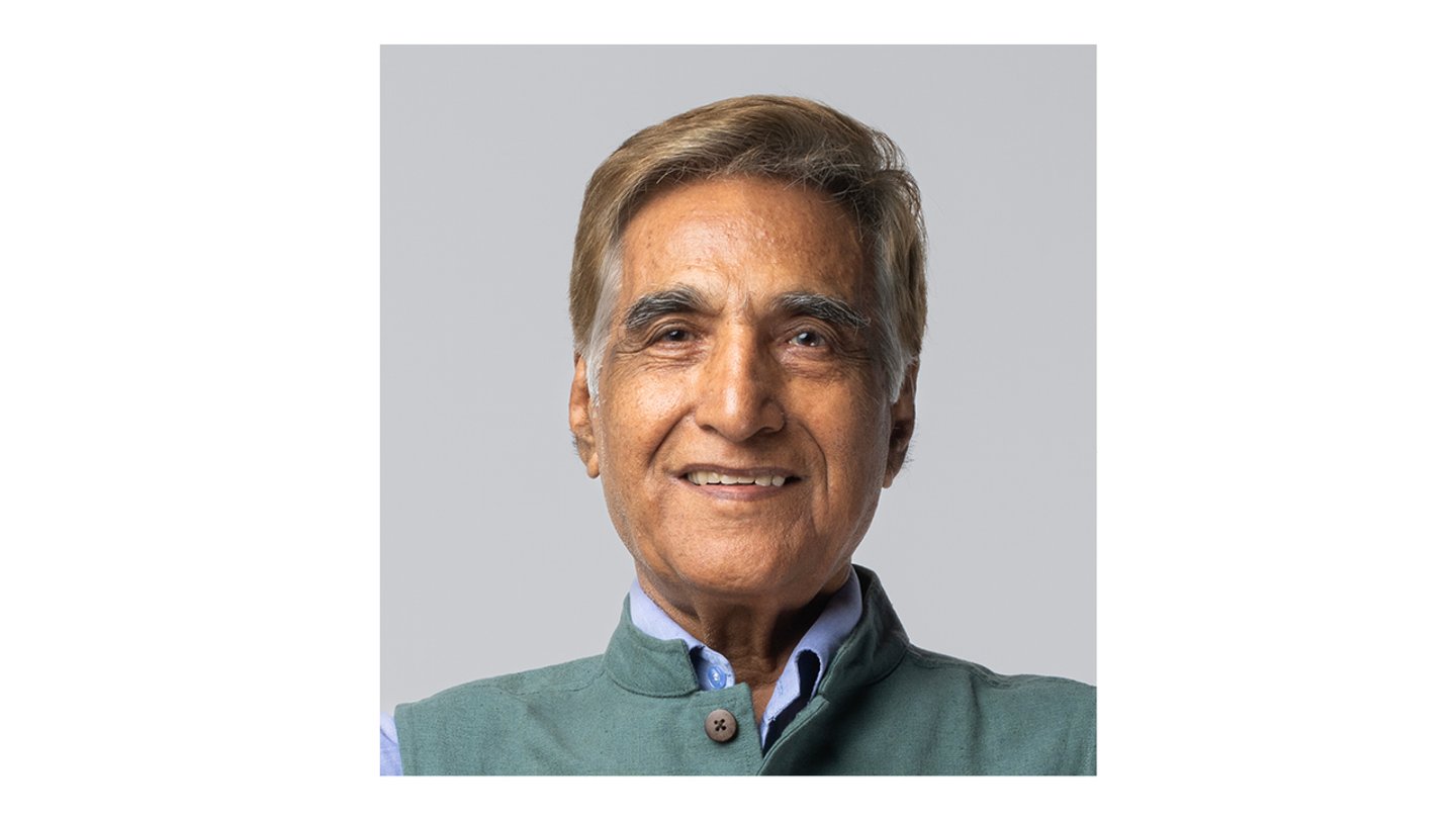 Middle-aged South Asian man with a blue shirt