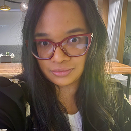 closeup of female pharmacy technician wearing glasses