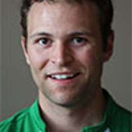 J.A. Happ wearing a striped shirt and smiling at the camera